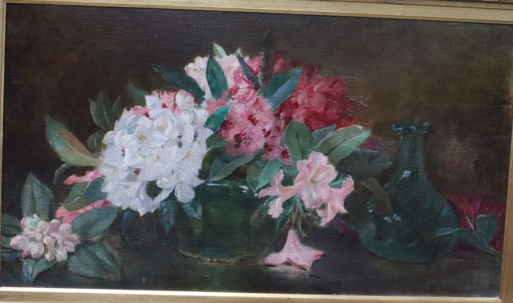 English School, oil on board, Still life of spring flowers on a table top, 44 x 80cm